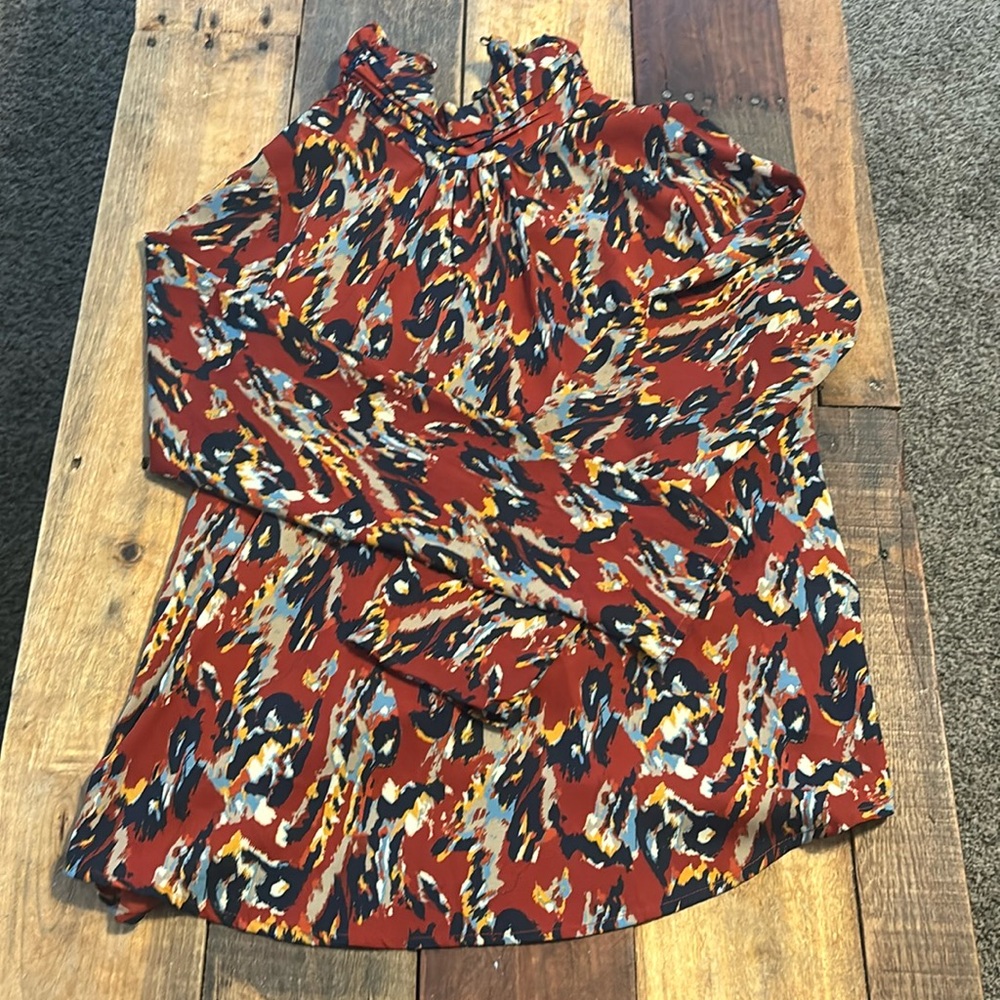 Rust pattern, mock neck blouse with button-down back